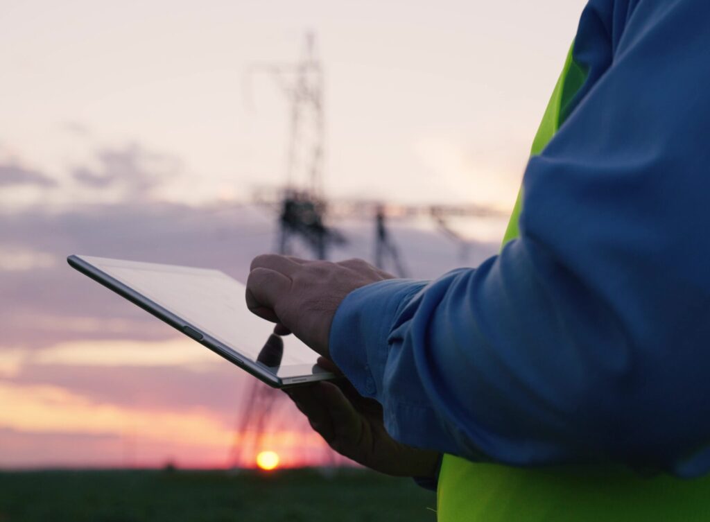 Solar worker holding a tablet in the field