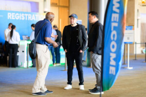 Attendees gather near the Registration desk at IESNA Texas 2025