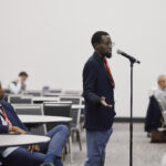 Attendee asking a question at IESNA Flagship 2026: New Paths, New Pressures: Financing Solar and Storage in a Post-ITC Era